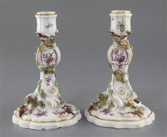 A pair of Chelsea gold anchor period candlesticks, c.1760, height 17.5cm and 17.7cm, one nozzle restored